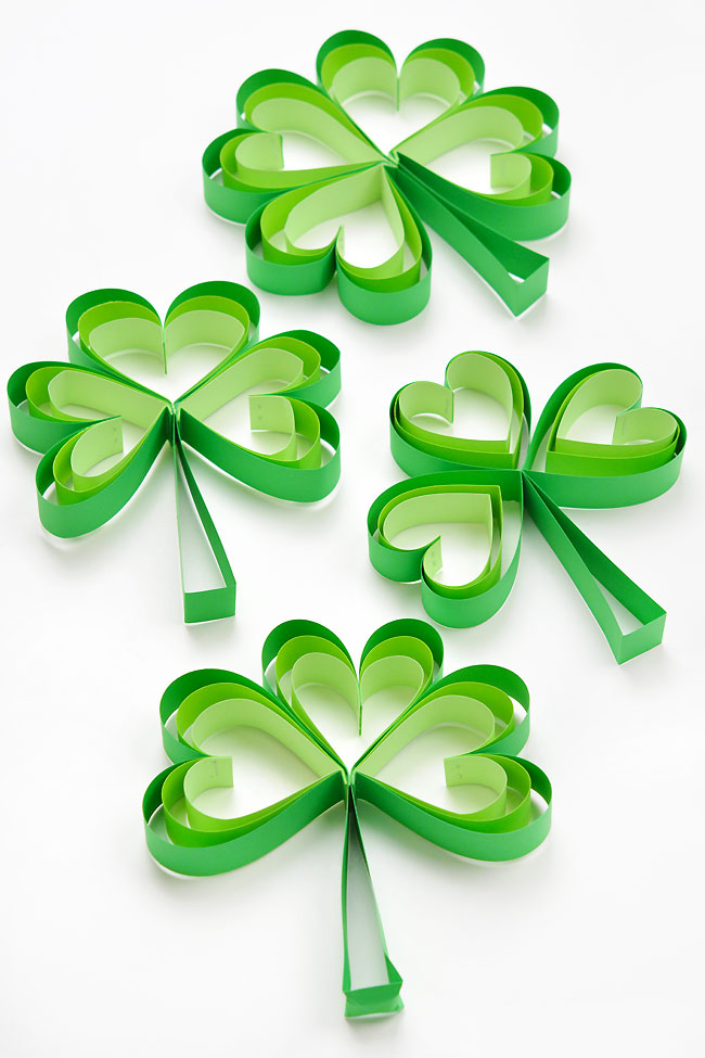 Cheerful group of 3D paper shamrocks
