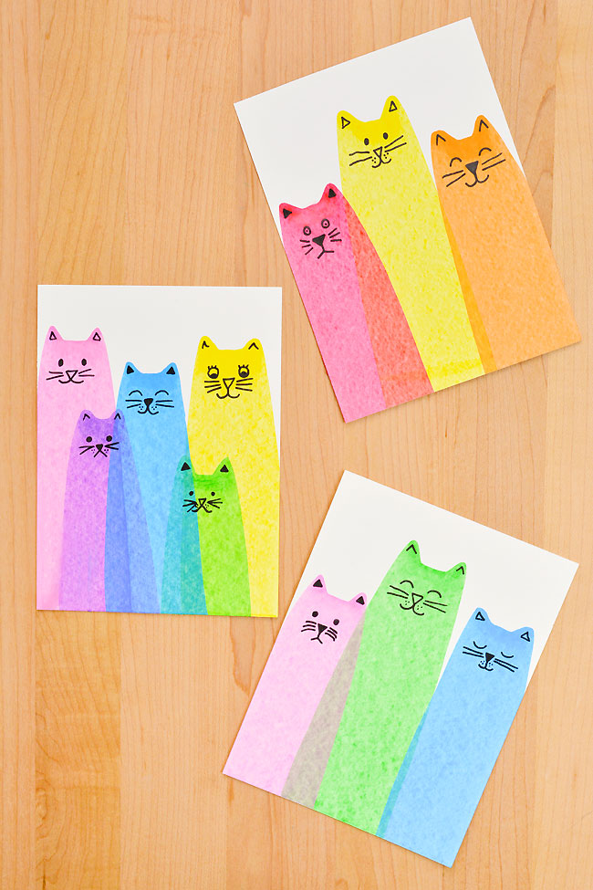Three different colourful groups of cat paintings made with a squeegee