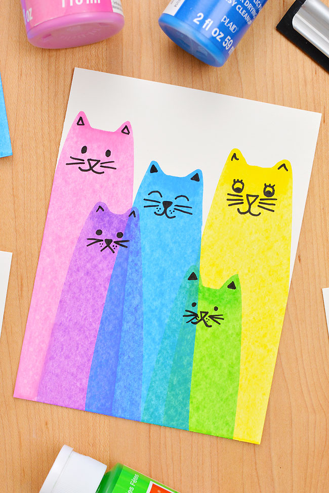 Overlapping cats made with squeegee art