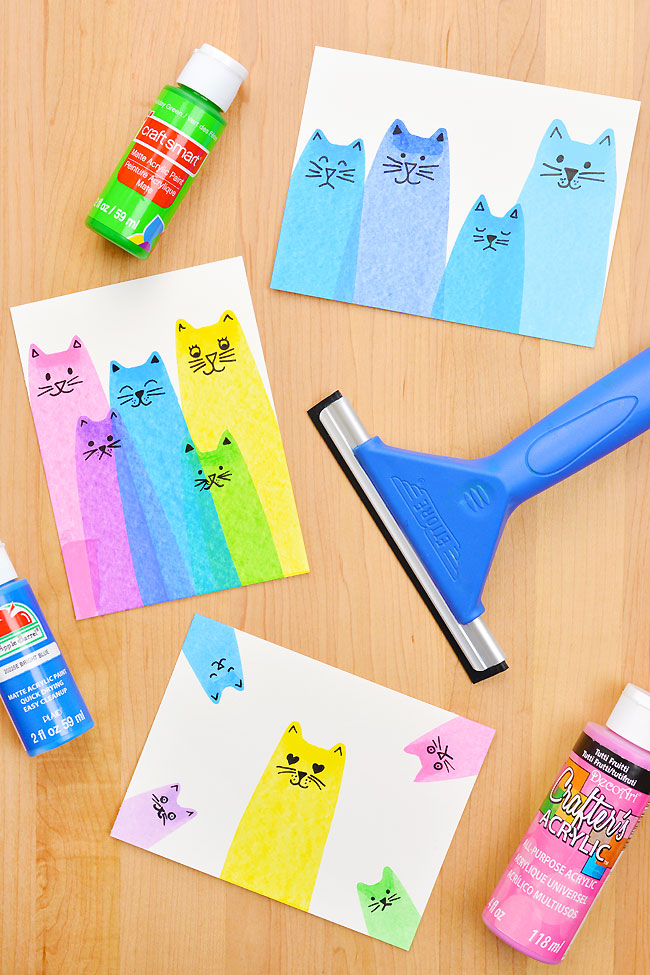 Colourful cats painted with a squeegee and acrylic paint