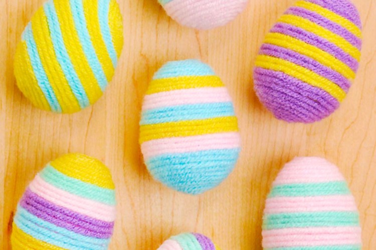 Easter egg craft made with plastic eggs and yarn