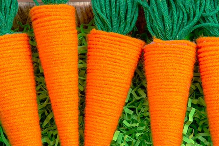 Yarn and cardstock forming an Easter carrot craft