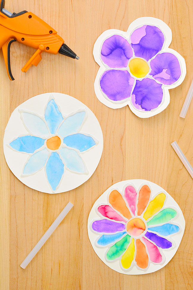 Flower outlines from hot glue painted with liquid watercolours