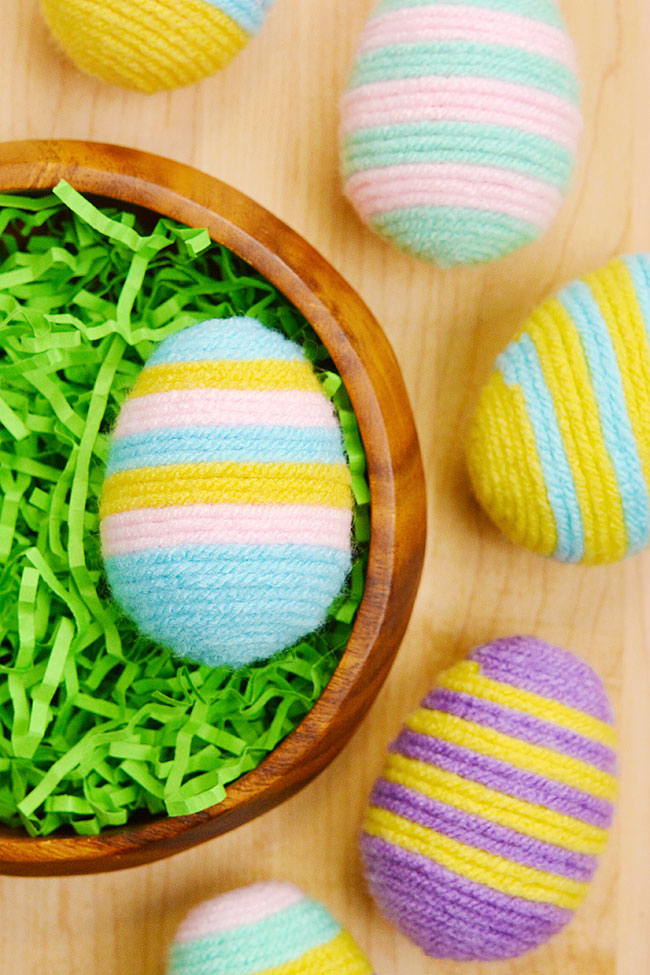 Easter eggs with a striped pattern made with yarn