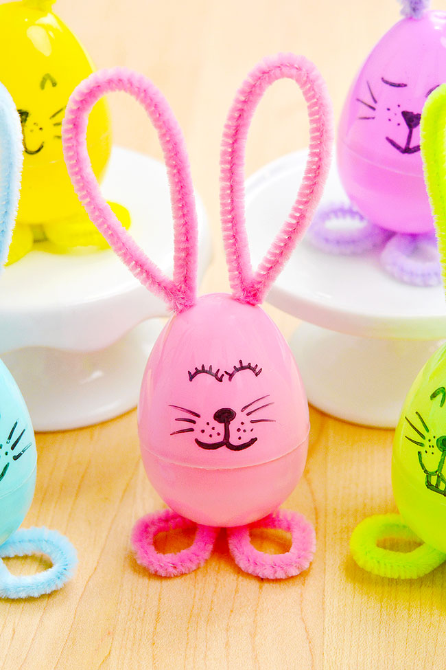 Group of colourful Easter bunnies made with a plastic egg and pipe cleaners