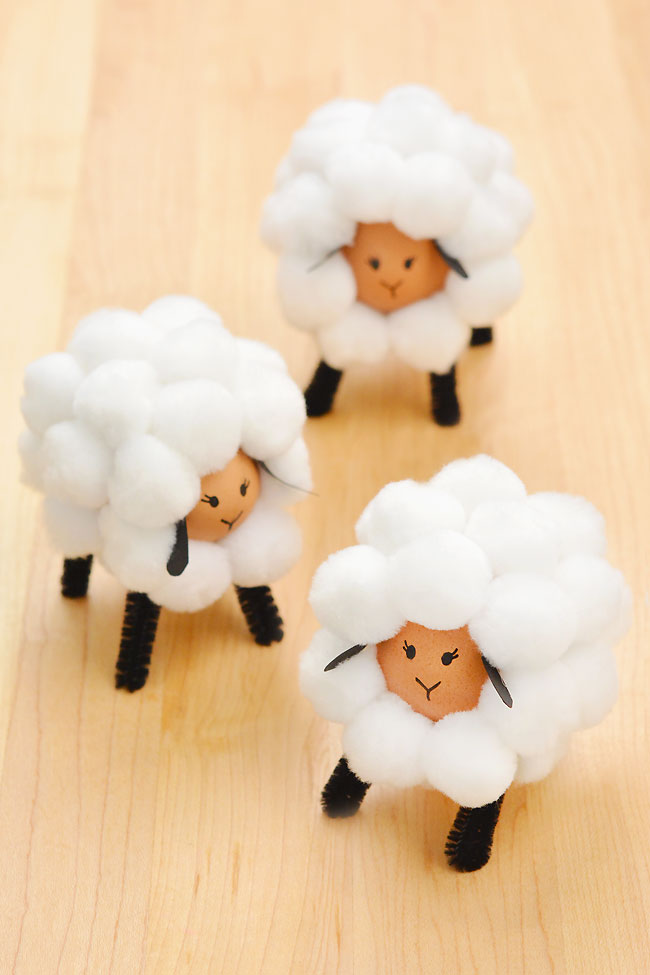 Easter eggs sheep craft standing on a wood background