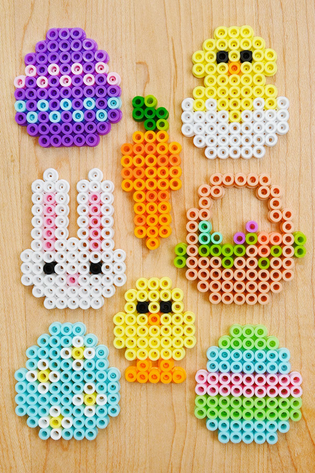 Cute Easter Perler beads designs on a wooden background