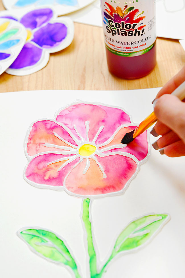 Painting inside a flower outline made with hot glue