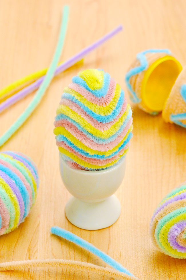 Soft pipe cleaner covered Easter egg sitting in an egg cup