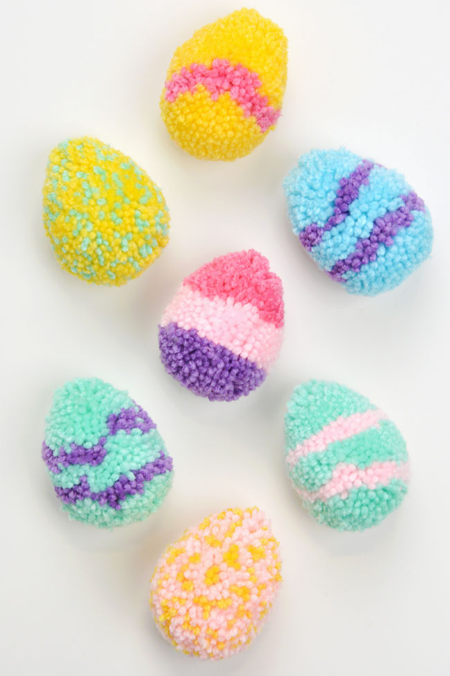 Colourful yarn pom pom Easter eggs