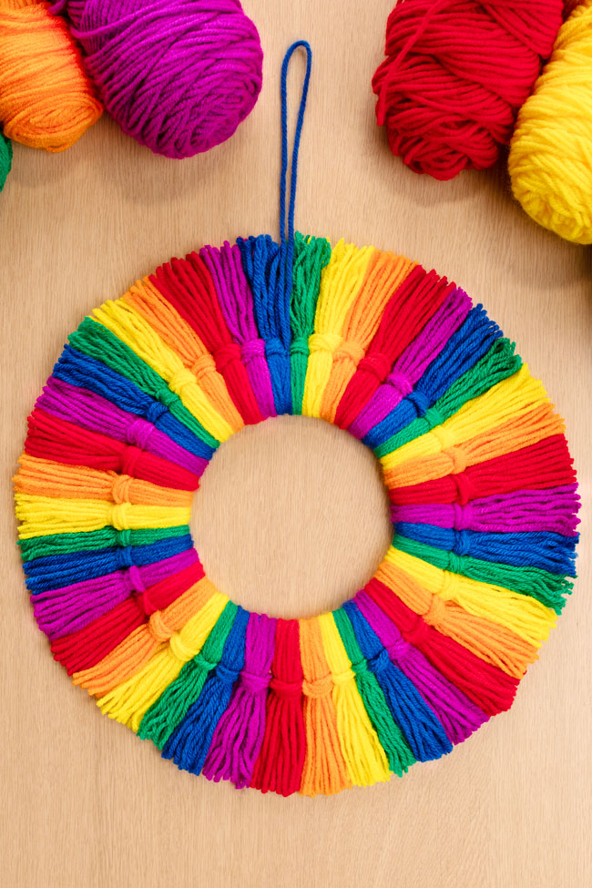 Rainbow tassel wreath made with colourful yarn
