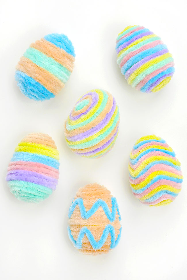 Easter eggs wrapped in pastel coloured chenille pipe cleaners