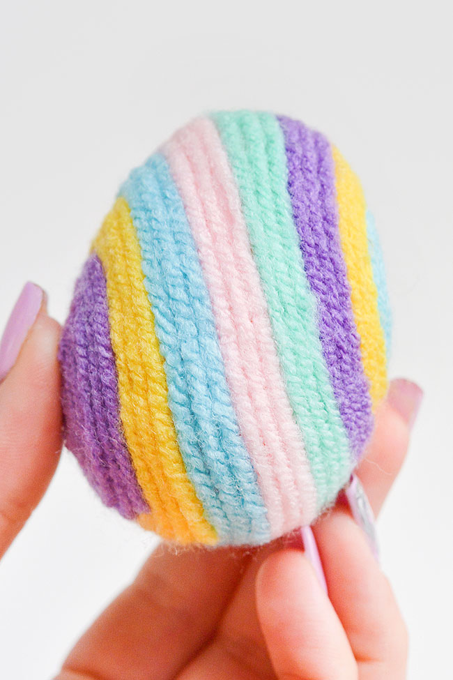 Plastic Easter egg wrapped in yarn