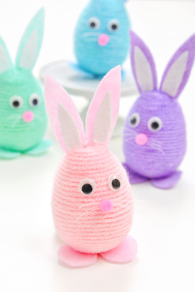 Easter bunny craft made with felt and a yarn wrapped plastic Easter egg
