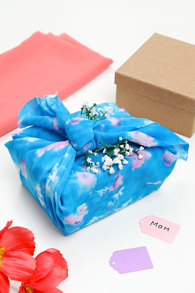 Fabric wrapped gift and supplies for furoshiki wrapping