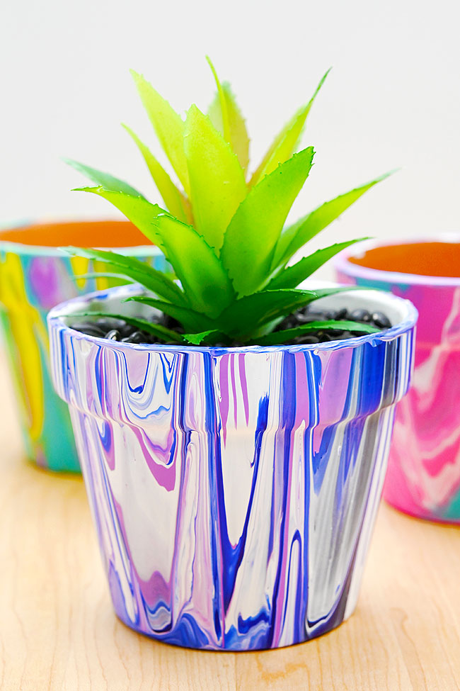Blue, purple, and white paint pouring flower pot design