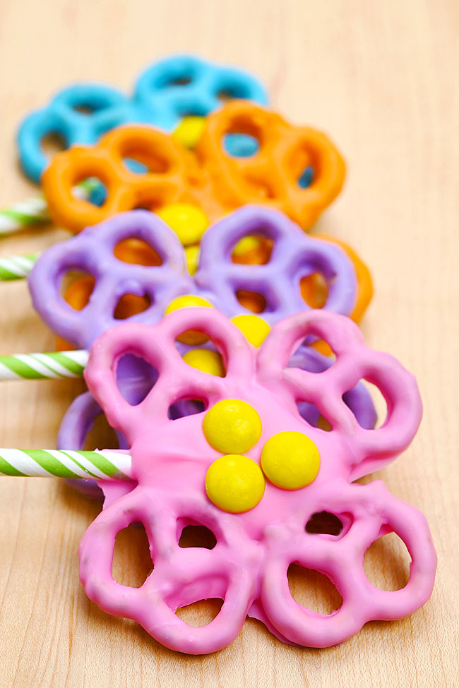 Bouquet of colourful flower pretzels on a wooden background
