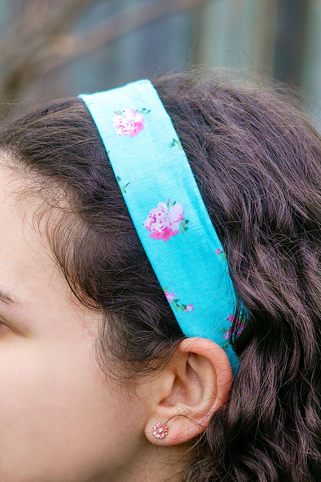 Wearing a blue and pink flower patterned cotton DIY headband