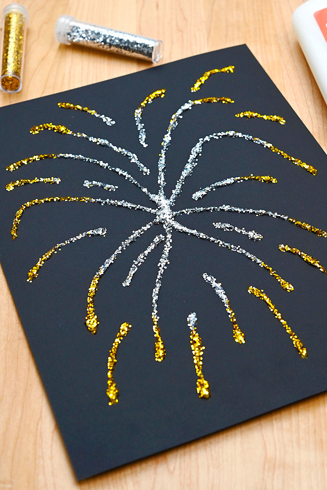 Silver and gold metallic fireworks art made with glue and glitter