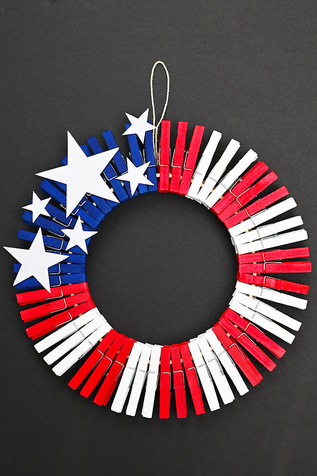 Clothespin wreath painted and decorated like the American flag