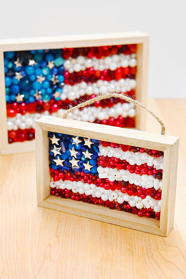 Framed 4th of July craft made with beads and a wood frame