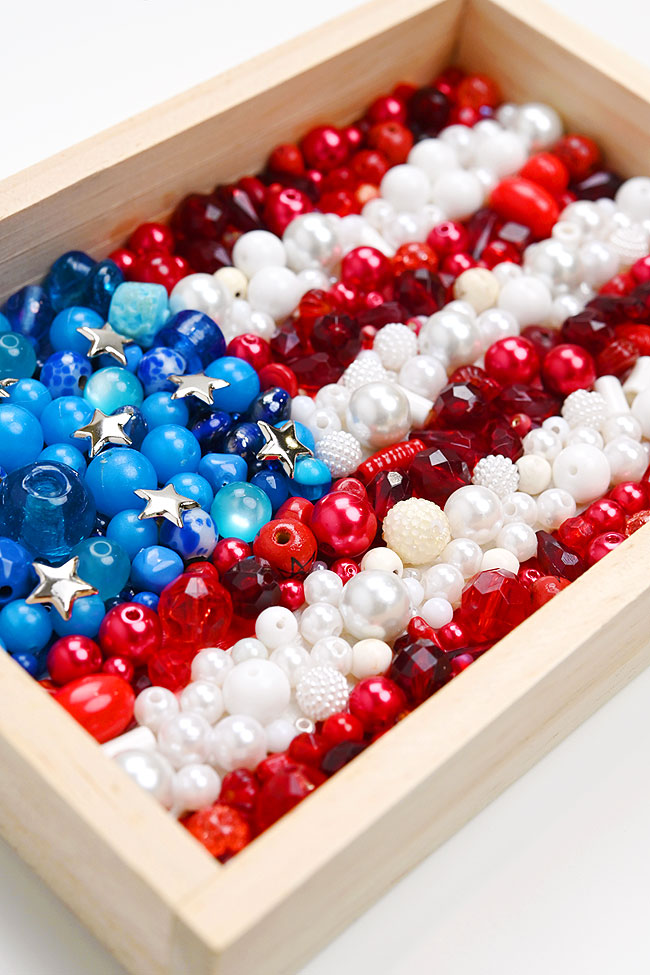 Closeup on beads glued in the shape of the American flag