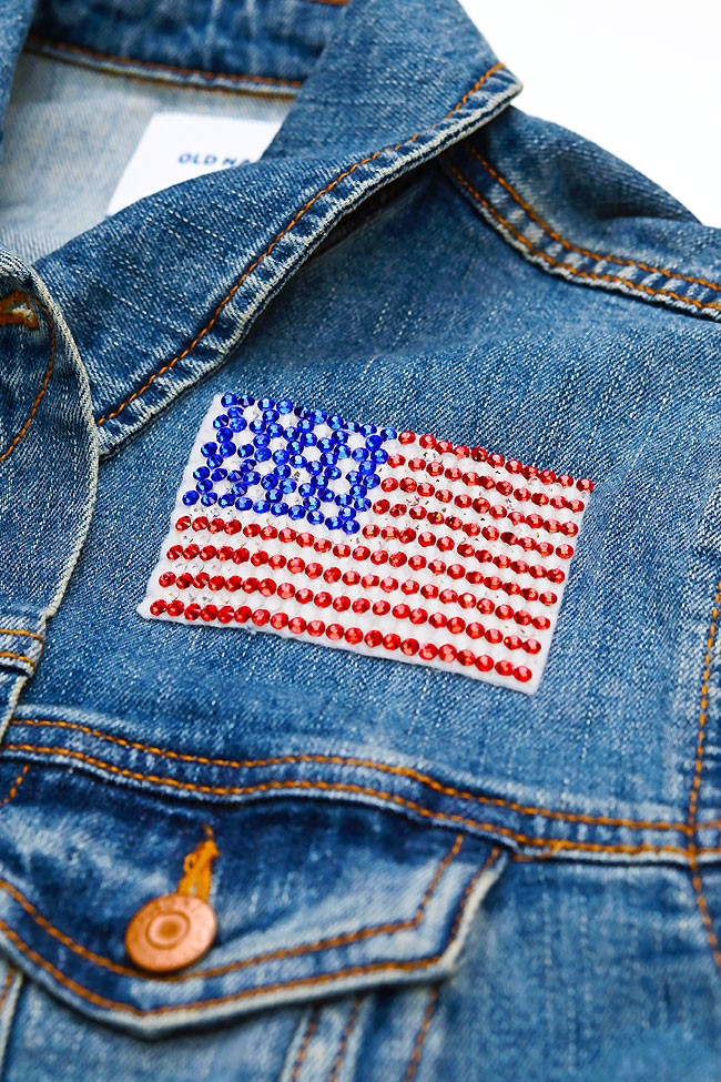 DIY American flag rhinestone patch on a denim jacket