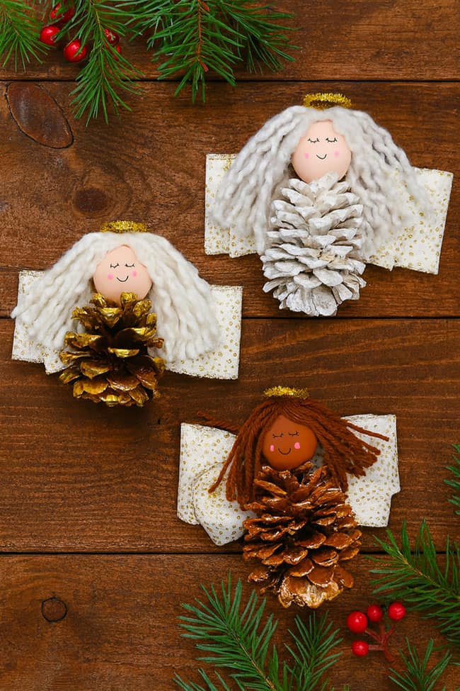 Angel Pine Cone Craft Lay flat picture of pine cone angels in different metallic colours