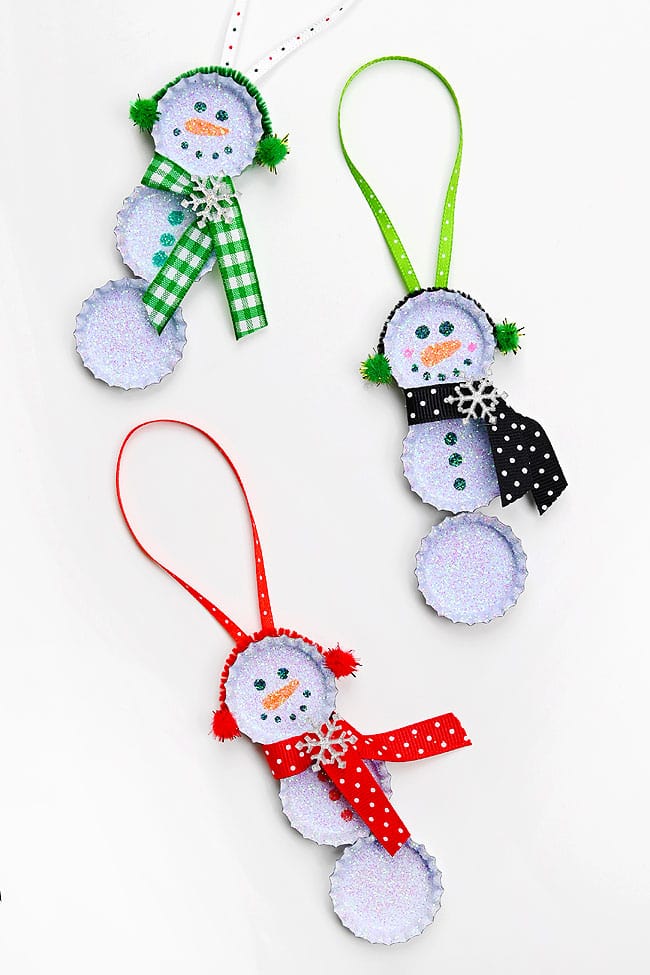 Bottle Cap Snowman Ornament Bottle cap snowman ornaments on a white background