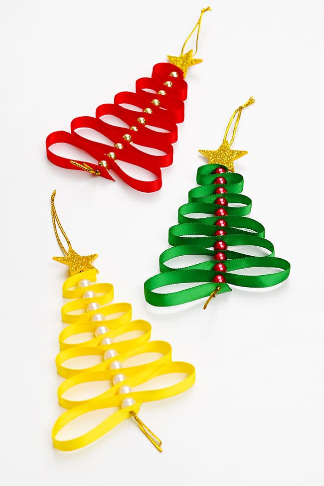 Christmas Tree Ribbon Ornaments Different colours of Christmas tree ribbon candy ornaments on a white background