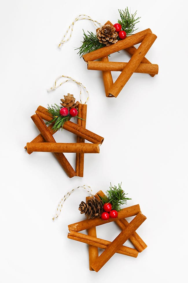 DIY Cinnamon Stick Star Ornament Several DIY cinnamon stick stars on a white background