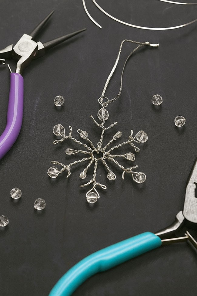 DIY Wire Snowflake With Beads Wire snowflake beside supplies to make one