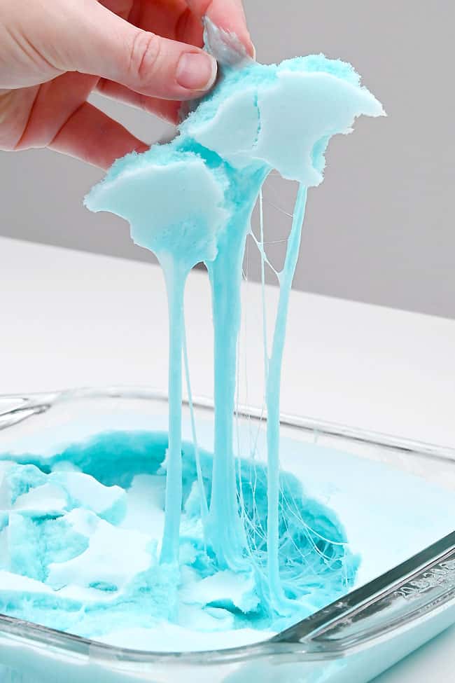 DIY Crackly Iceberg Slime Pulling up crackly layer of iceberg slime