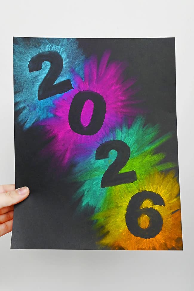 New Years Art for Kids Holding a colorful 2026 new year's chalk art page