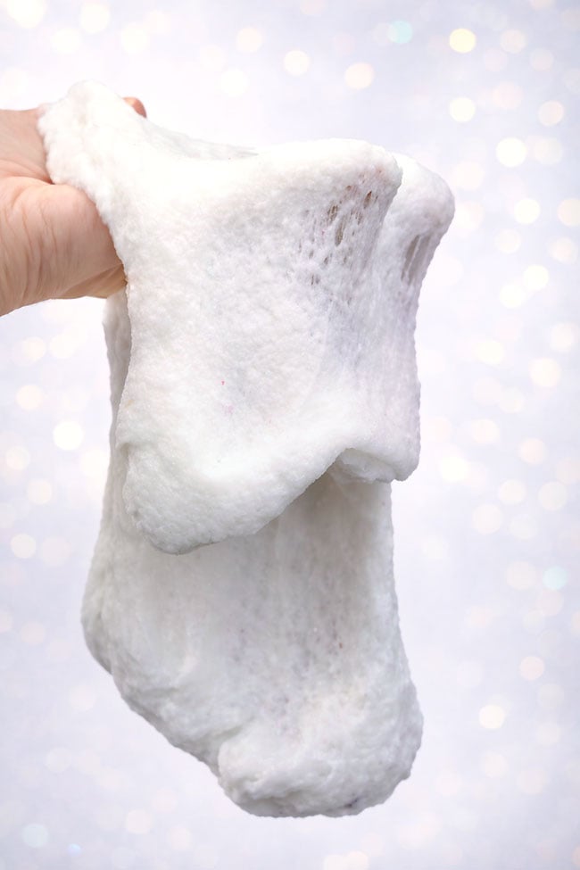 How to Make Snow Slime Thick snow slime dripping off a hand