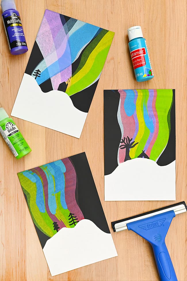Colourful northern lights squeegee paintings