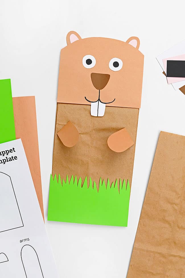 Paper Groundhog Puppet Paper groundhog puppet sitting with craft supplies to make one