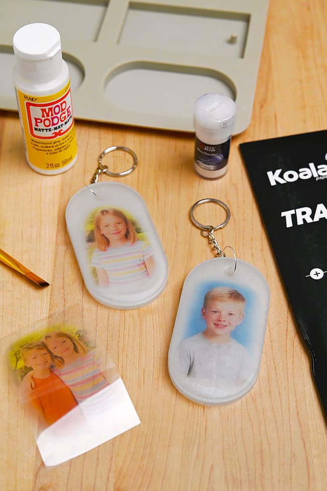 Photo in Resin Resin photo keychains beside supplies to make them