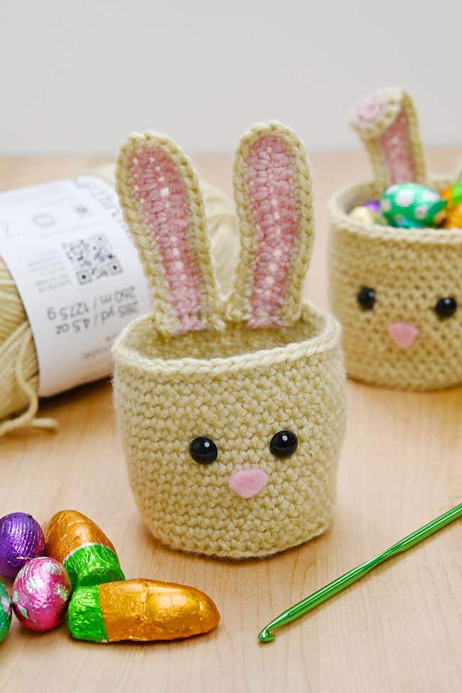 Mini Crochet Bunny Baskets Easter bunny baskets crocheted beside supplies to make one
