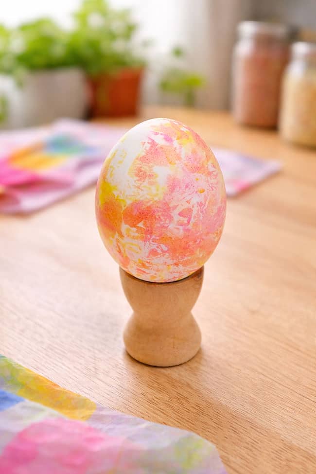 Tissue Paper Dyed Eggs Closeup on an orange and pink dyed Easter egg