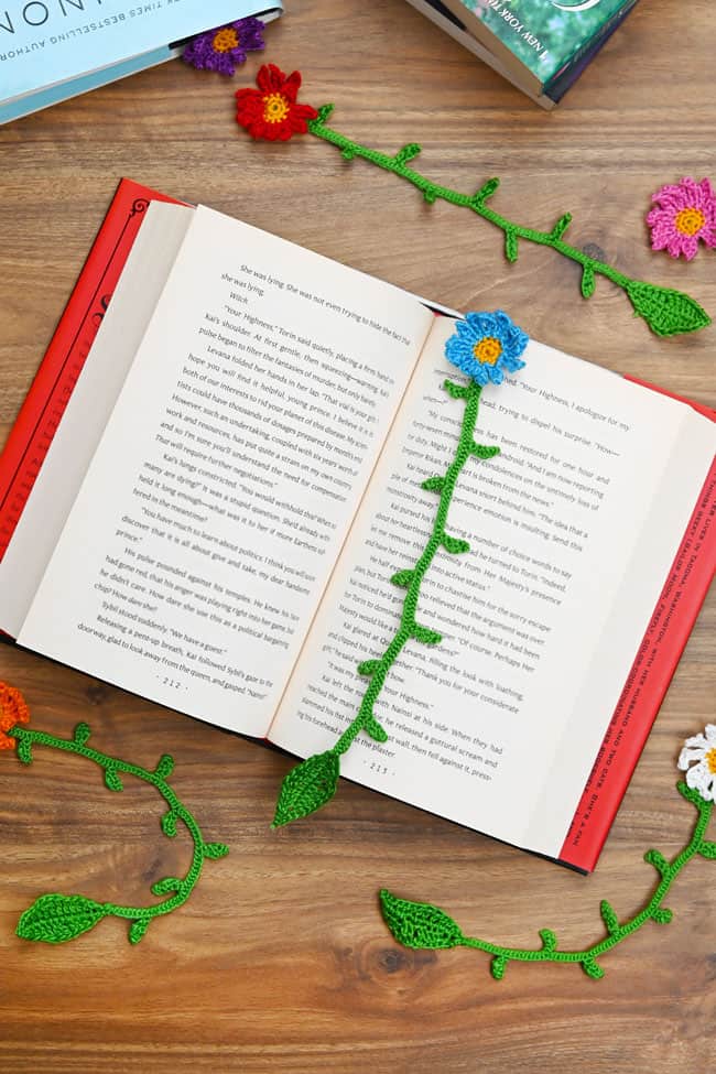 Crochet Flower Bookmark Cute lay flat scene with an open book and crochet flower bookmarks