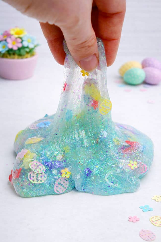 How to Make Easter Slime Stretching up slime from a pile of confetti Easter slime