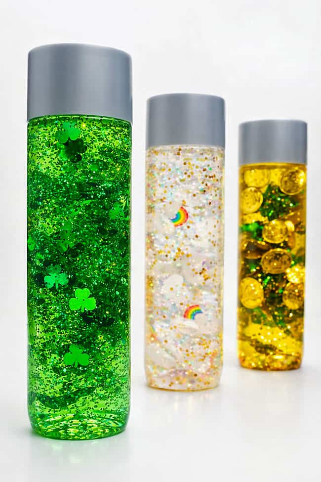 3 colourful versions of festive St. Patrick's Day sensory bottles