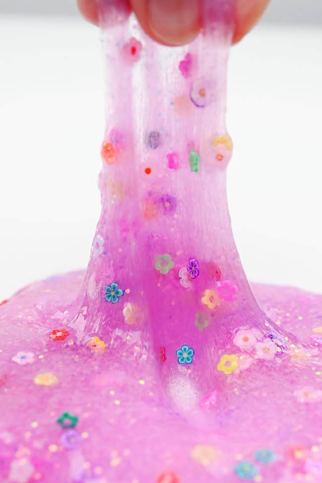 How to Make Spring Slime Closeup on the clay flower confetti in clear spring slime