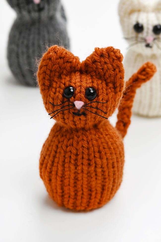 Knit Cat Pattern Loom Closeup on an orange cat made with our free loom knit pattern