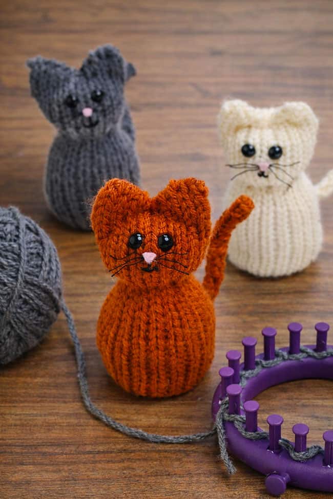 Loom Knit Cat Pattern Group of loom knitted cats with supplies to make them