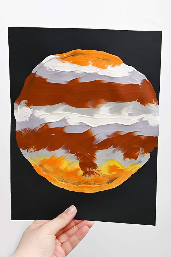 Planet Printing Art for Kids Holding a picture of paint print planet Jupiter