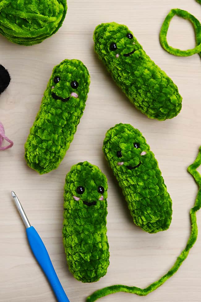 Crochet Pickle Pattern Cute group of crochet pickle plushies with supplies to make them