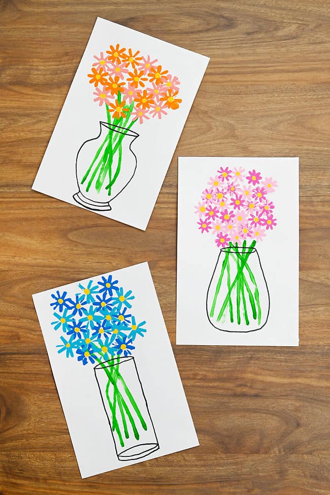 Flower Straw Painting Craft Vases of straw painted flowers in orange, pink, and blue
