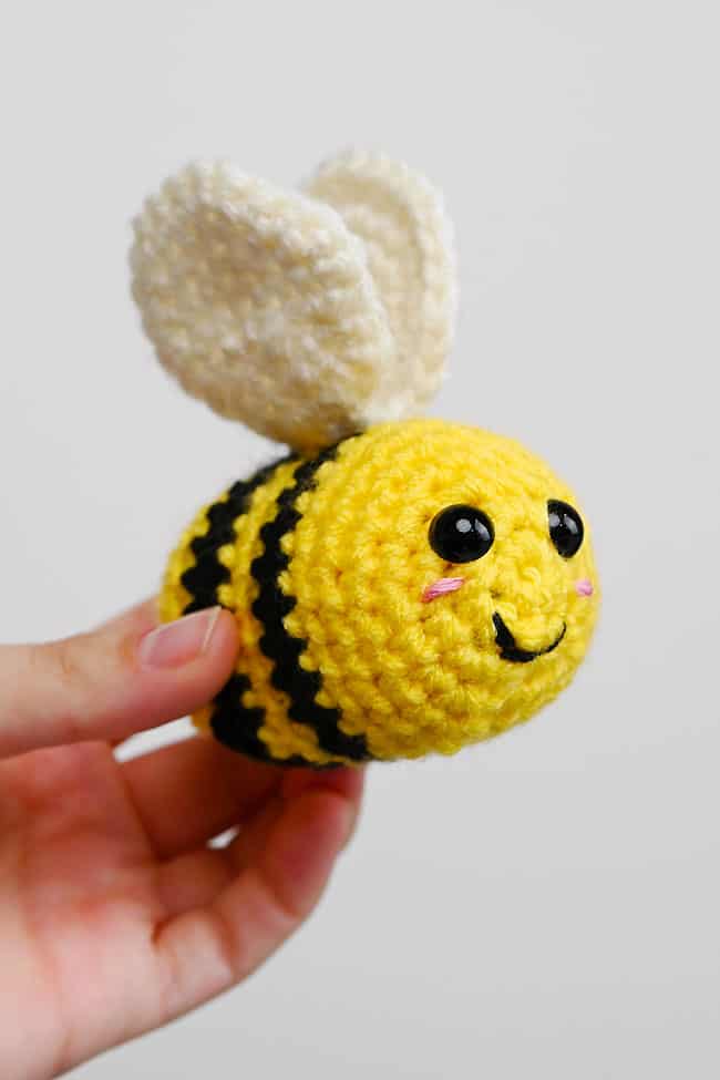 How to Crochet a Bee Holding a mini crocheted bee